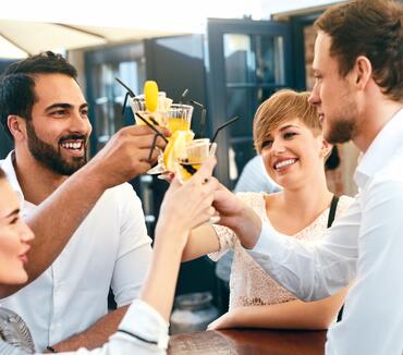Friends Celebrating, Drinking In Bar Outdoors